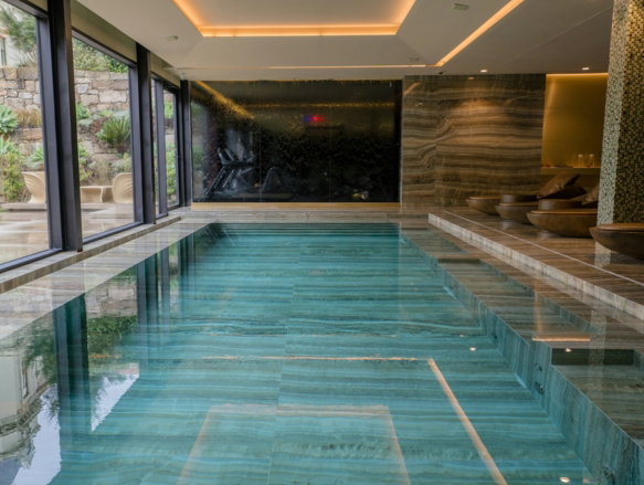 A large indoor swimming pool in a house
